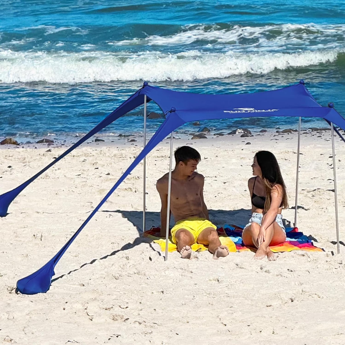 SUN NINJA 10x10.5 FT Pop-Up Beach Tent with Sand Shovel, Pegs & Stability Poles Navy Blue Sun Shelter for Beach, Camping & Outdoor Activities
